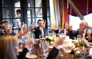 A discussion at a dinner party.